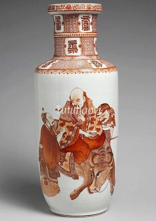 Guimet porcelain vase decorated with iron red enamel of Laozi riding on a buffalo met by Yinxi