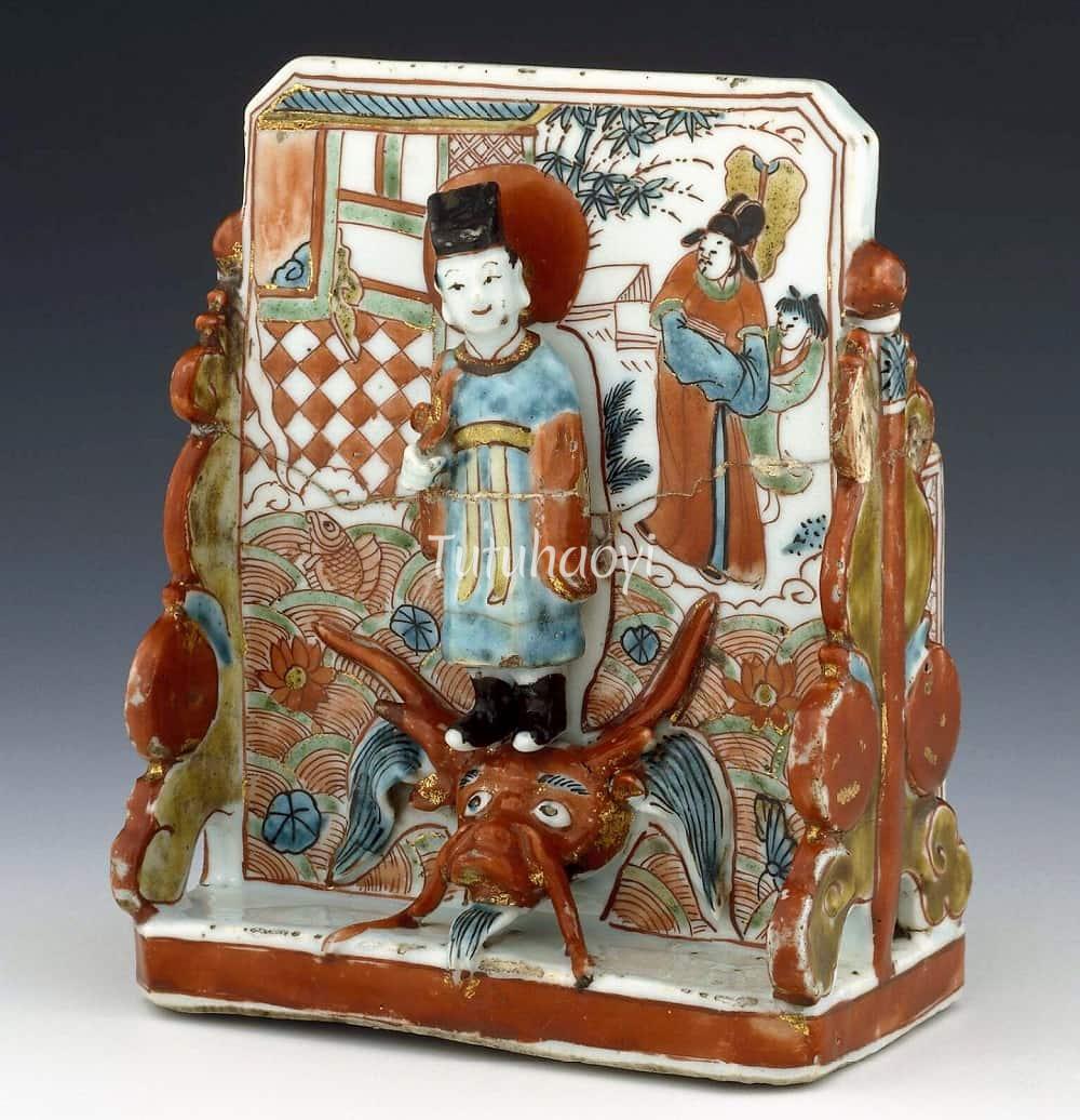 porcelain desk stand scholar on top of a dragon-carp